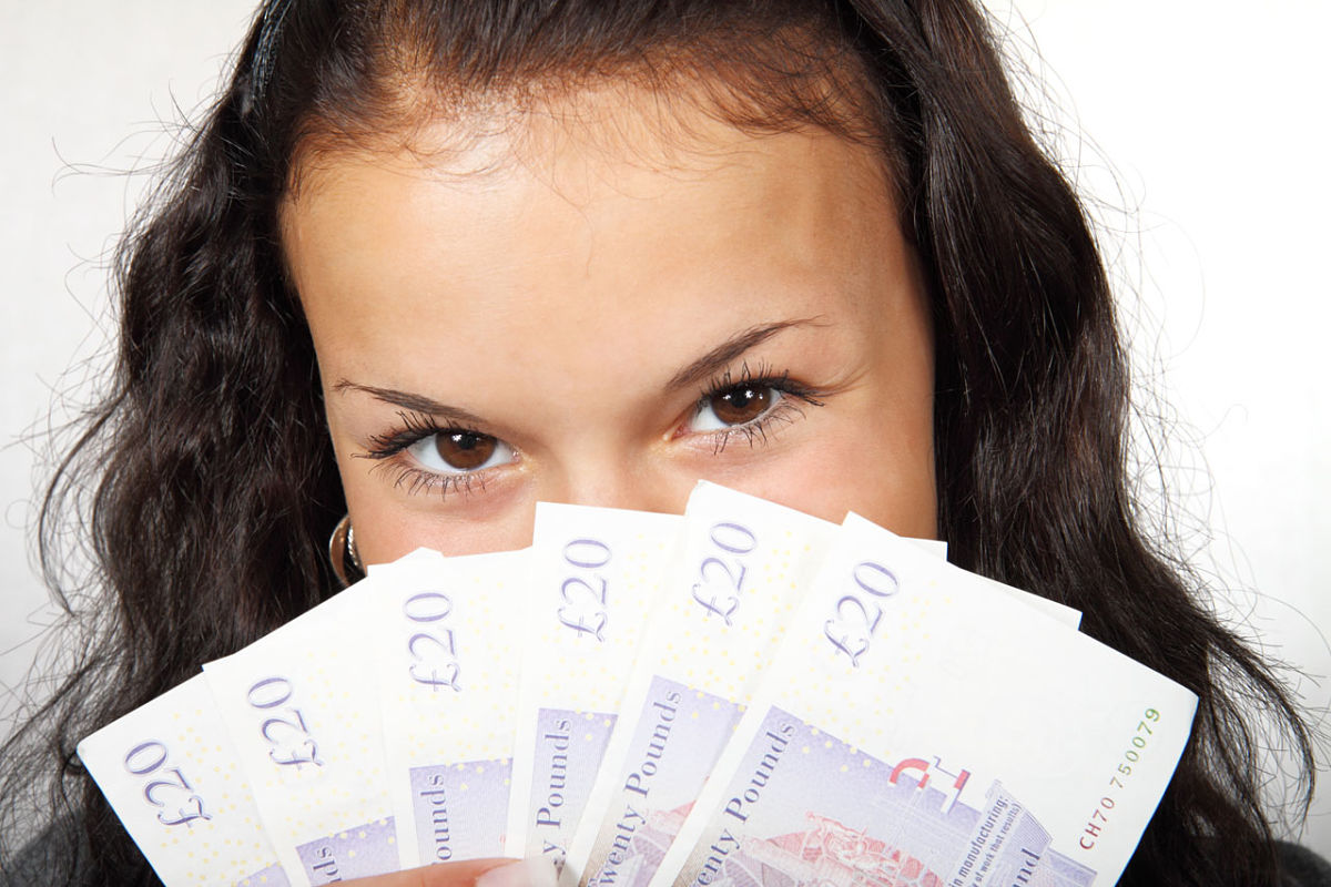 girl holding money